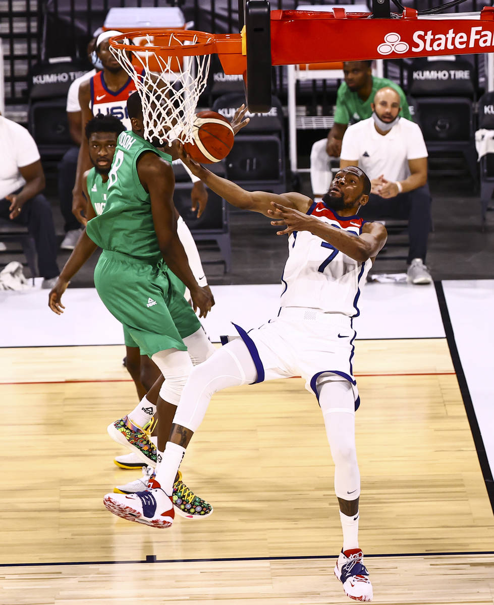 USA Basketball's Kevin Durant (7) gets fouled by Nigeria’s Ekpe Udoh (8) during the seco ...