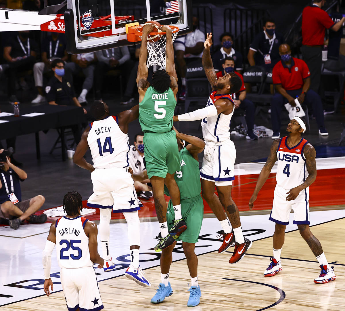 NigeriaÕs Stanley Okoye (5) dunks against USA during the second half of an exhibition game ...