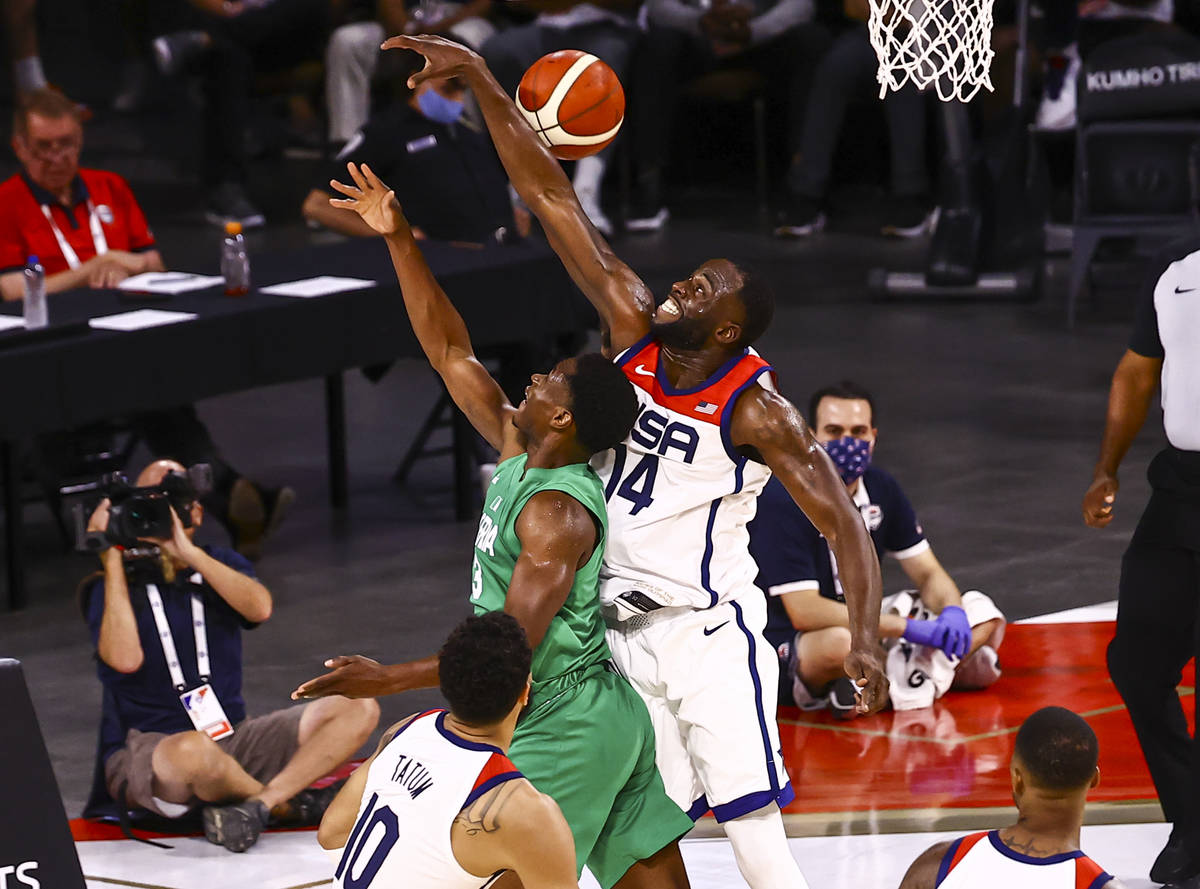 USA Basketball's Draymond Green (14) defends as Nigeria Caleb Agada (3) goes to the basket duri ...