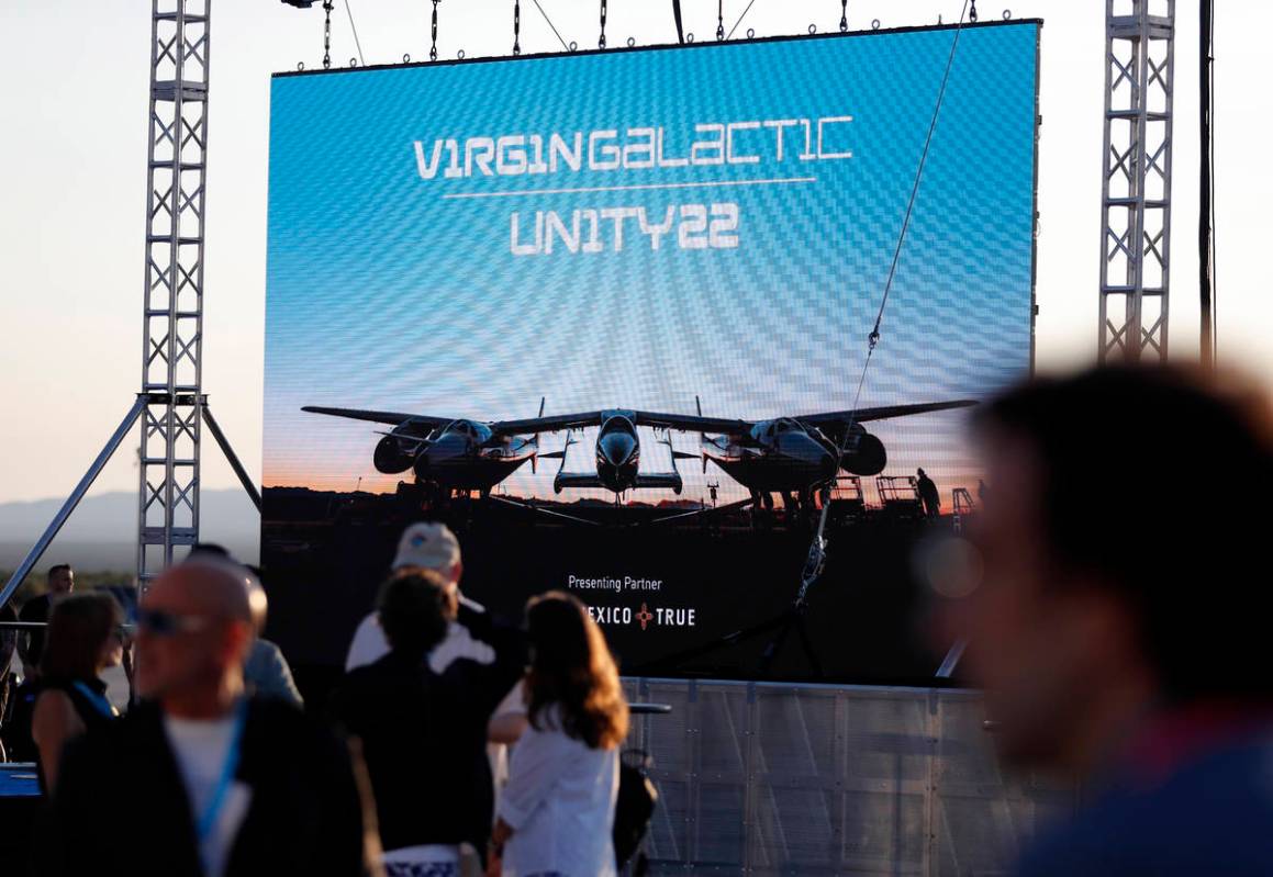 Special guests chat as they wait for Virgin Galactic founder Richard Branson's launch to space ...