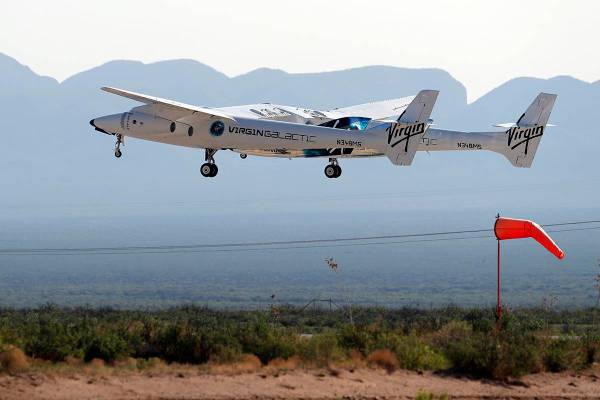 The rocket plane carrying Virgin Galactic founder Richard Branson and other crew members takes ...