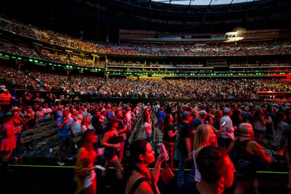 Fans enjoy the music and refreshments as Garth Brooks performs before the crowd at Allegiant St ...
