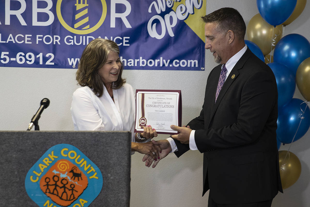 Jack Martin, director of Clark County Juvenile Justice Services, receives a certificate of cong ...