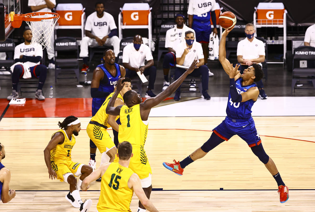 USA's Keldon Johnson (40) shoots over Australia's Duop Reath (1) during the first half of an ex ...