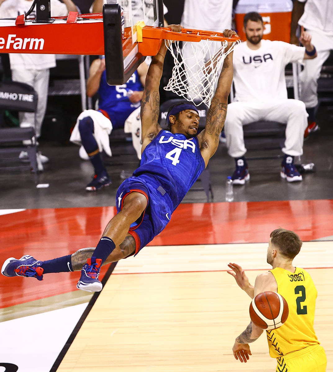 USAճ Bradley Beal (4) dunks the ball over Australia's Nathan Sobey (2) during the first h ...