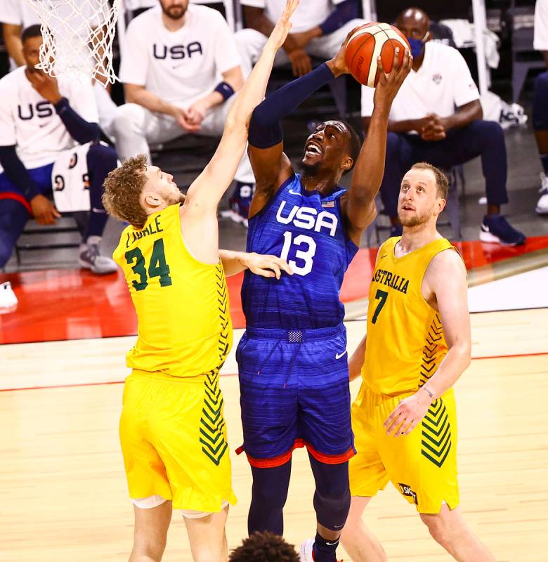 USA’s Bam Adebayo (13) shoots between Australia's Jock Landale (34) and Joe Ingles (7) d ...