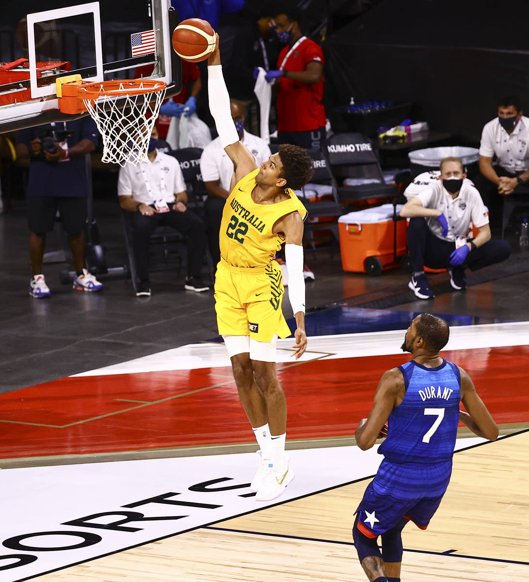 Australia's Matisse Thybulle (22) goes to the basket in front of USAճ Kevin Durant (7) du ...