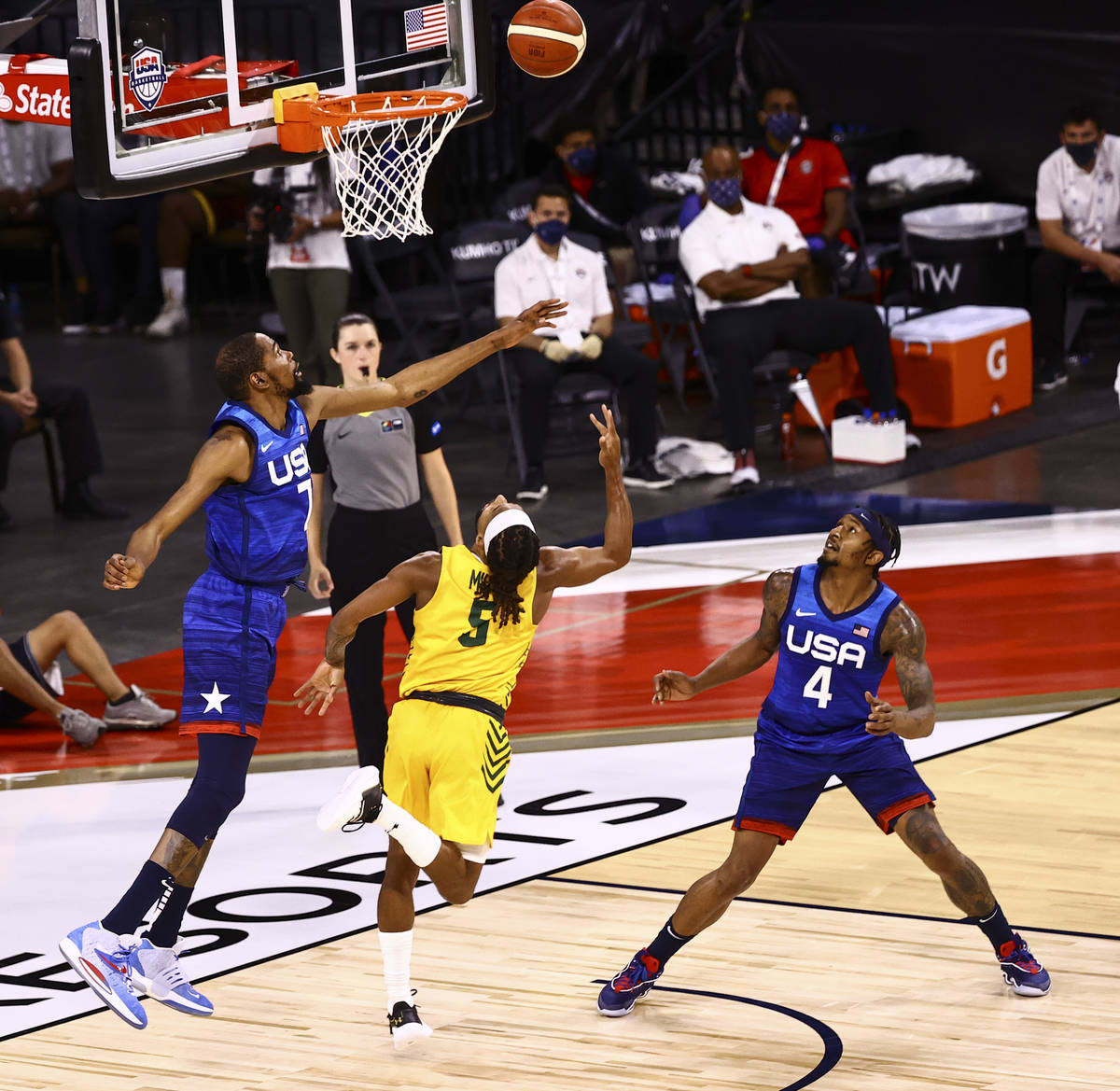 Australia's Patty Mills (5) lays up the ball as USAճ Kevin Durant (7) defends during the ...