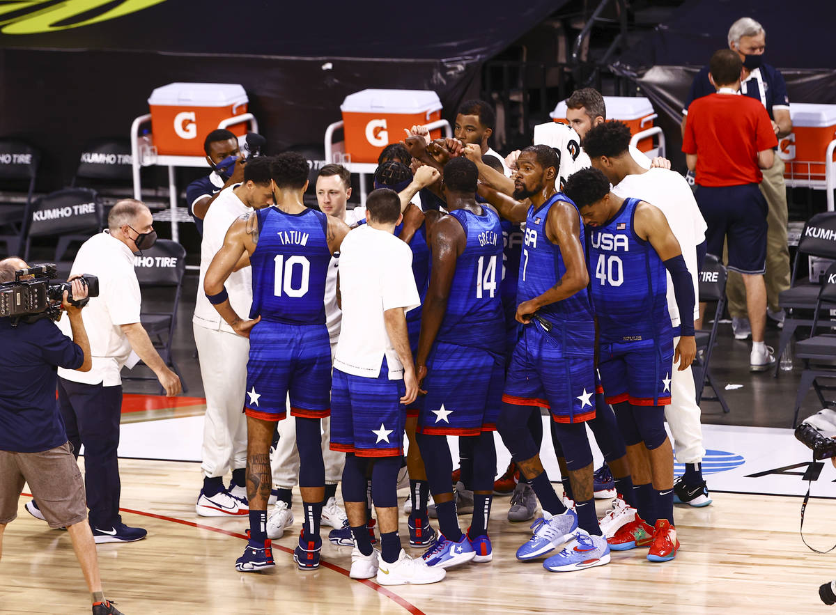 USA Basketball players huddle after losing to Australia in an exhibition basketball game ahead ...