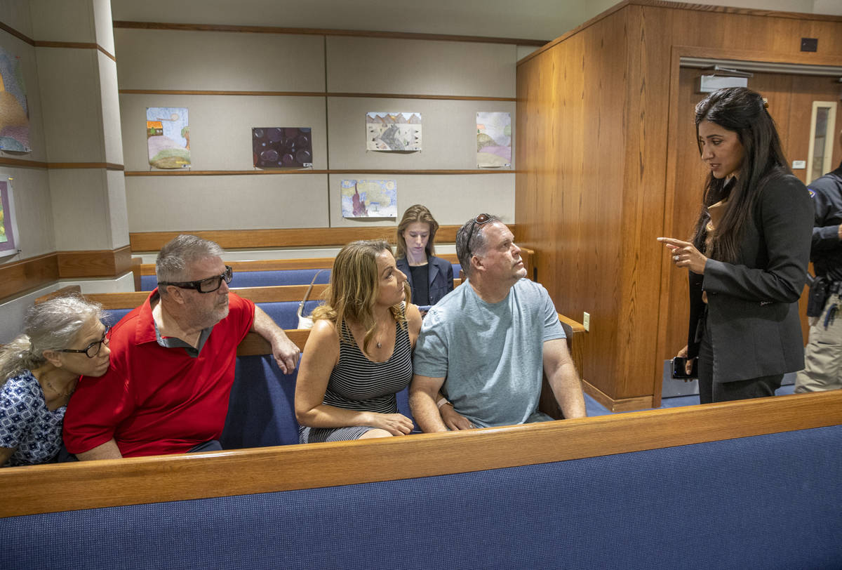 Chief Deputy District Attorney Tina Talim, right, speaks to Marty and Tami Slatsky with friends ...