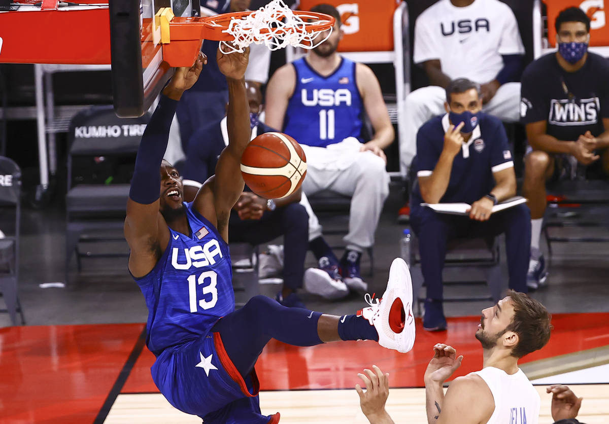 USA's Bam Adebayo (13) dunks the ball in front of Argentina’s Marcos Delia (12) during t ...