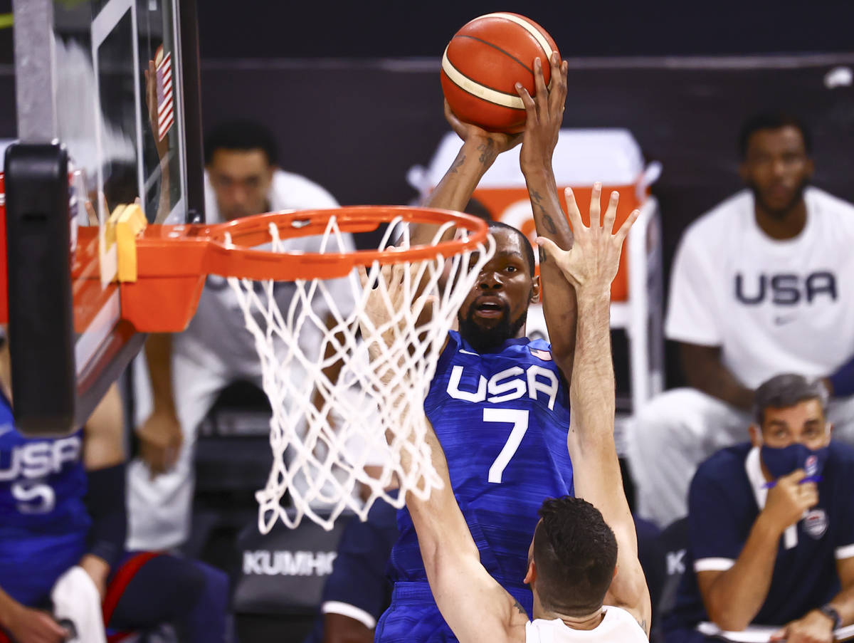 USA’s Kevin Durant (7) shoots over Argentina’s Patricio Garino during the first h ...