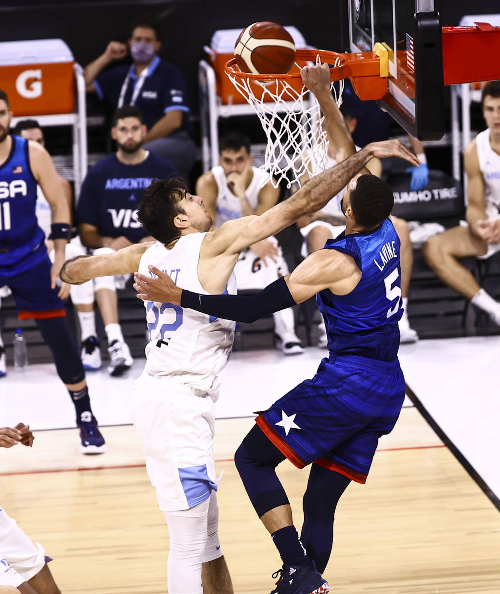 USAÕs Zach Lavine (5) dunks the ball while being fouled by ArgentinaÕs Juan Pablo Vaulet (22) ...