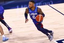 USA's Damian Lillard (6) brings the ball up court against Argentina during the first half of an ...
