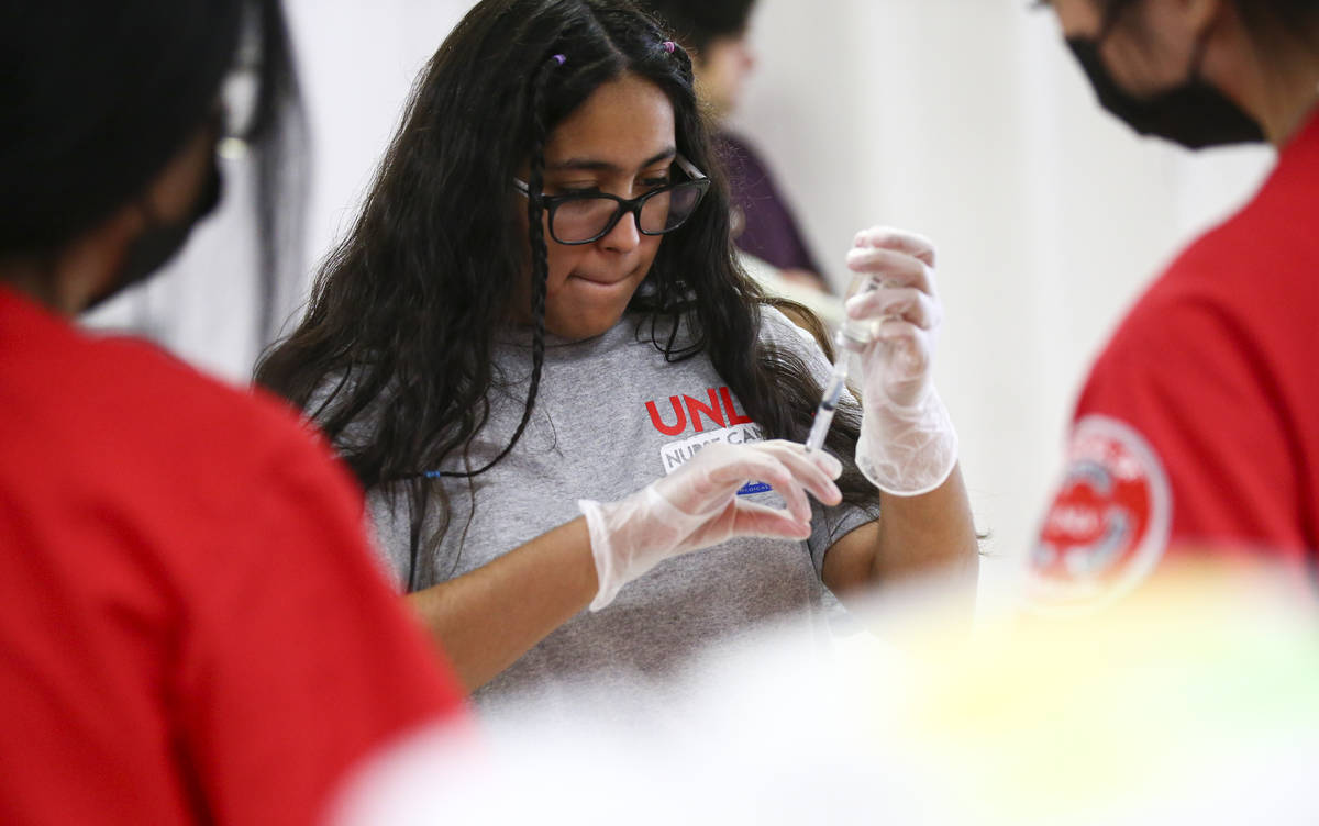 Camila Puente, a junior at Advanced Technologies Academy, participates at the intravenous medic ...