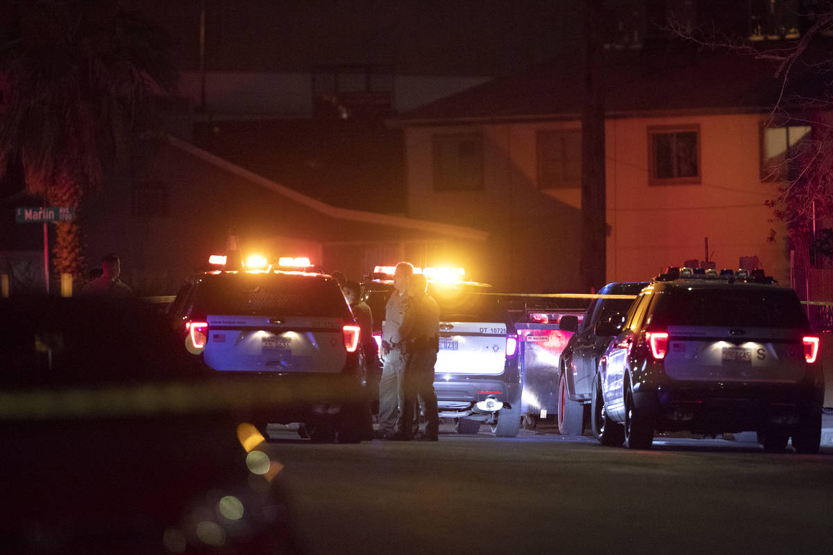Metropolitan police investigate a homicide near the intersection of Marlin Avenue and 14th Stre ...