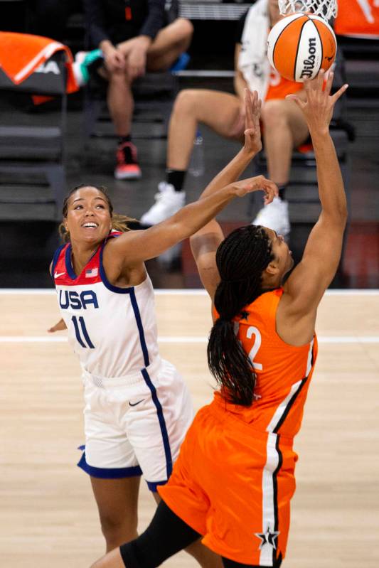 U.S. Women's National Team's Napheesa Collier (11) attempts to block a shot by Team WNBA's Brio ...