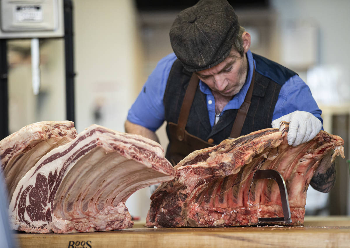 Martin Kirrane, owner and butcher at Featherblade Craft Butchery, carves beef at his shop in La ...
