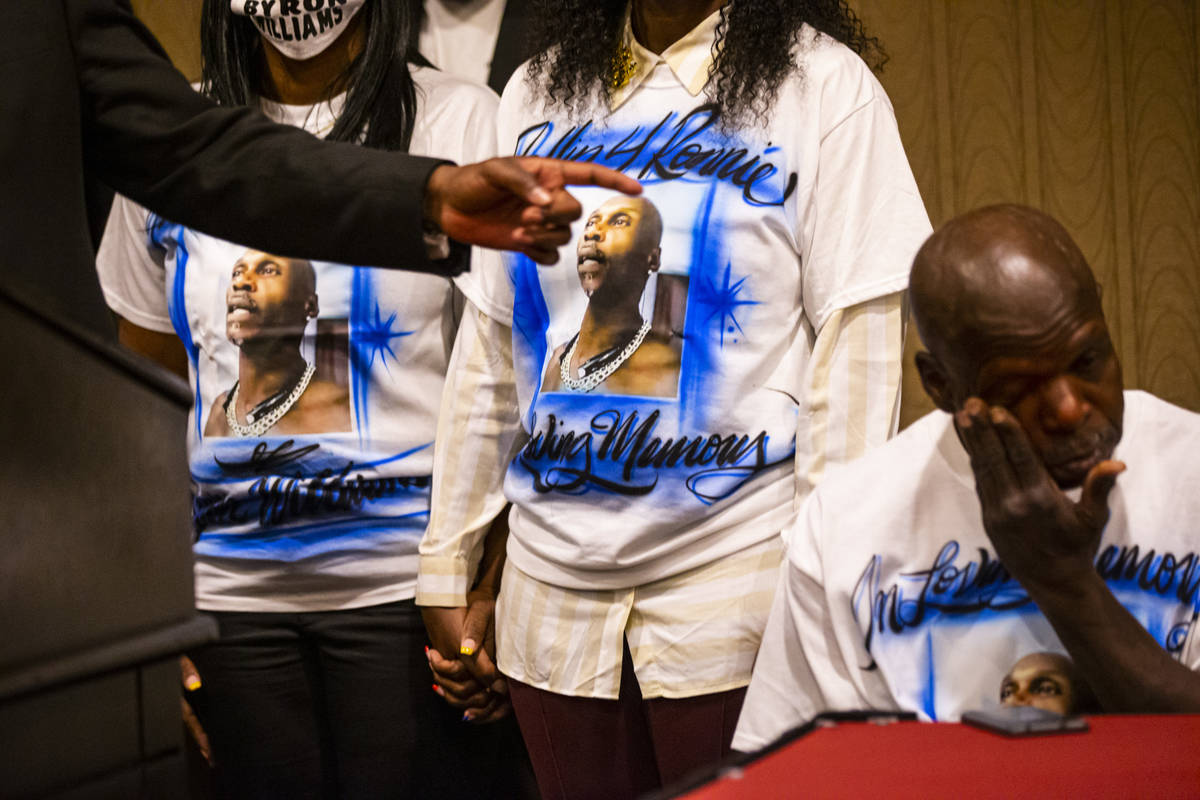 Civil rights attorney Ben Crump, left, points to the family of Byron Williams during a news con ...