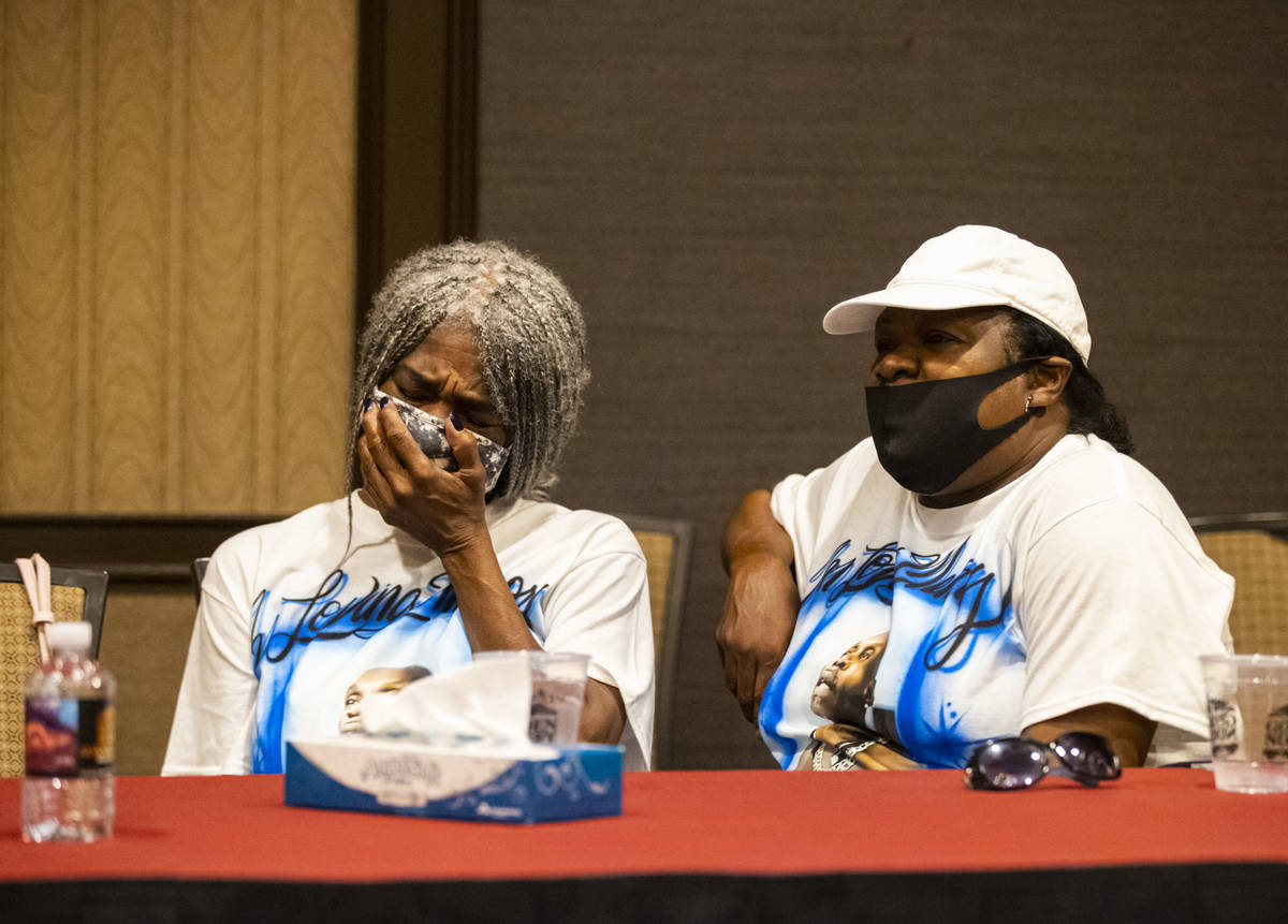 Cheryl Lewis, left, and Gwendolyn Lewis, sisters of Byron Williams, listen during a news confer ...