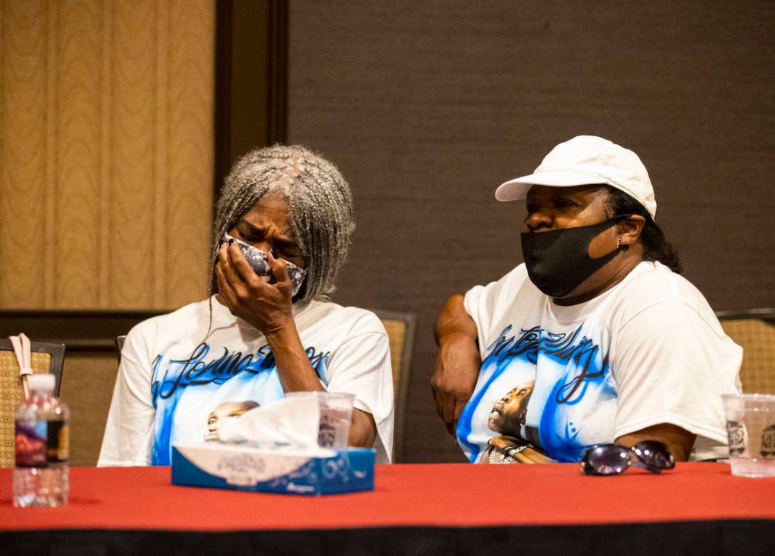 Cheryl Lewis, left, and Gwendolyn Lewis, sisters of Byron Williams, listen during a news confer ...