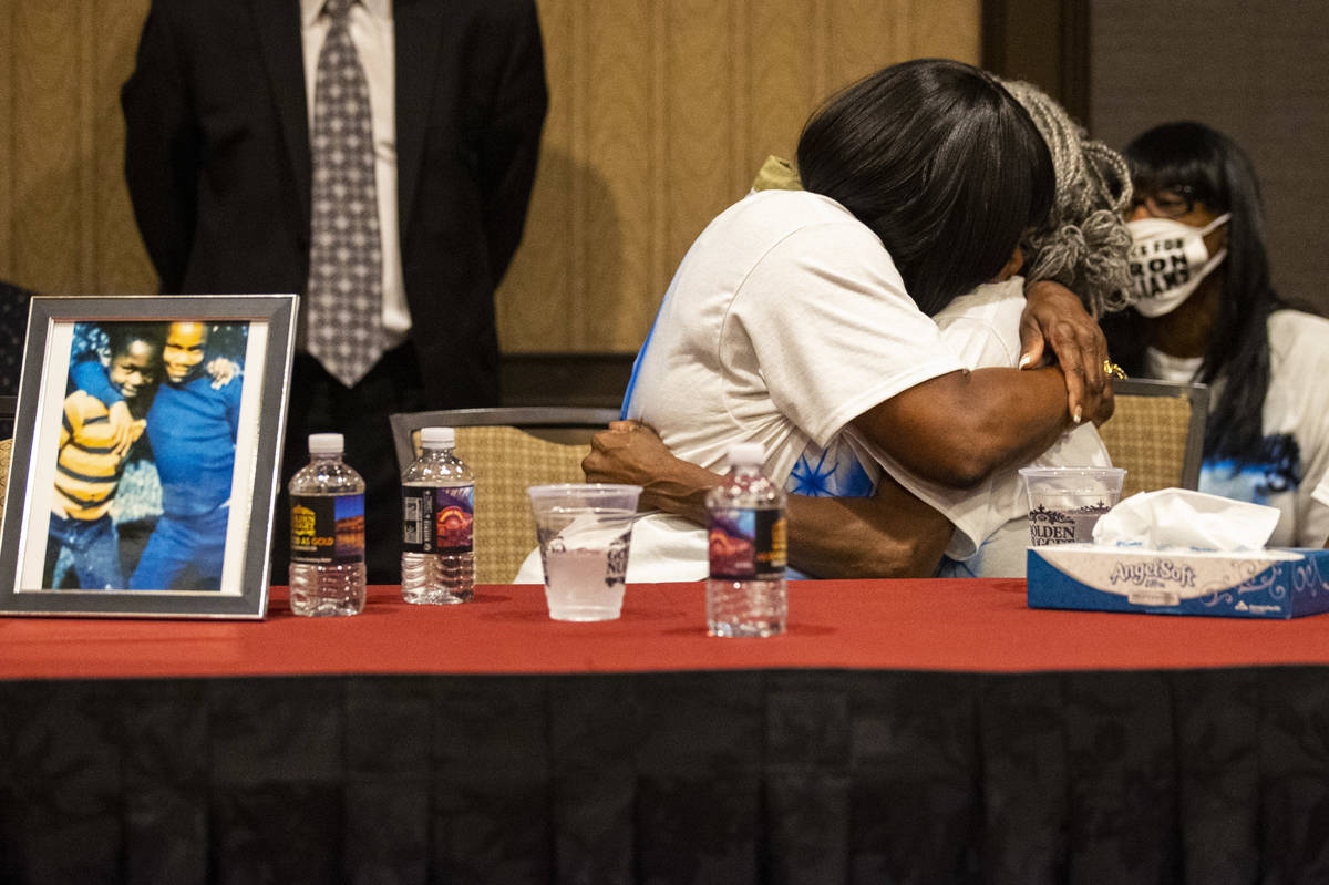 Robyn Lewis, left, and Cheryl Lewis, sisters of Byron Williams, embrace during a news conferenc ...