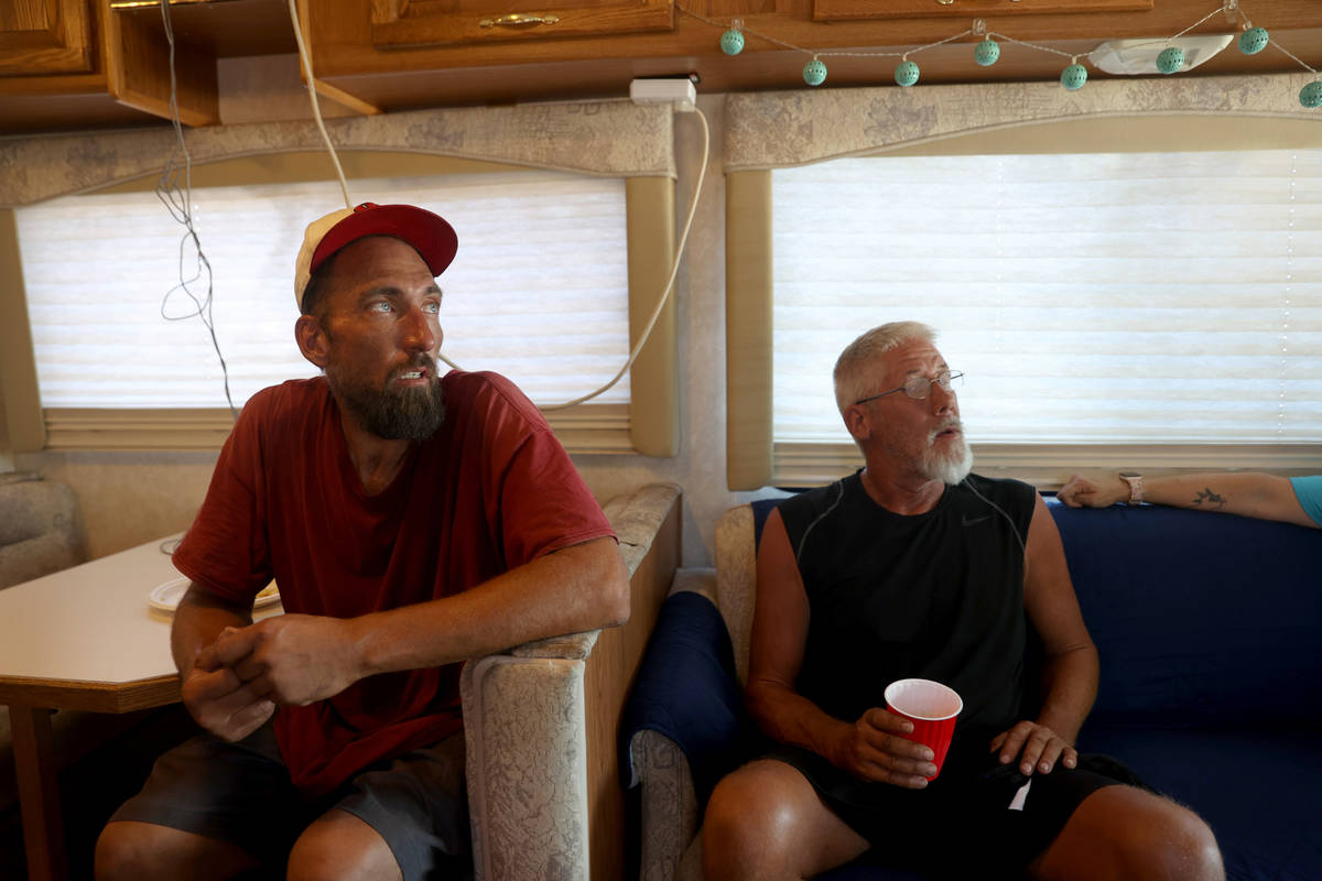 Eric Gutierrez, 39, left, and Gregory Hemminger, 59, wait for showers in an RV operated by Cup ...