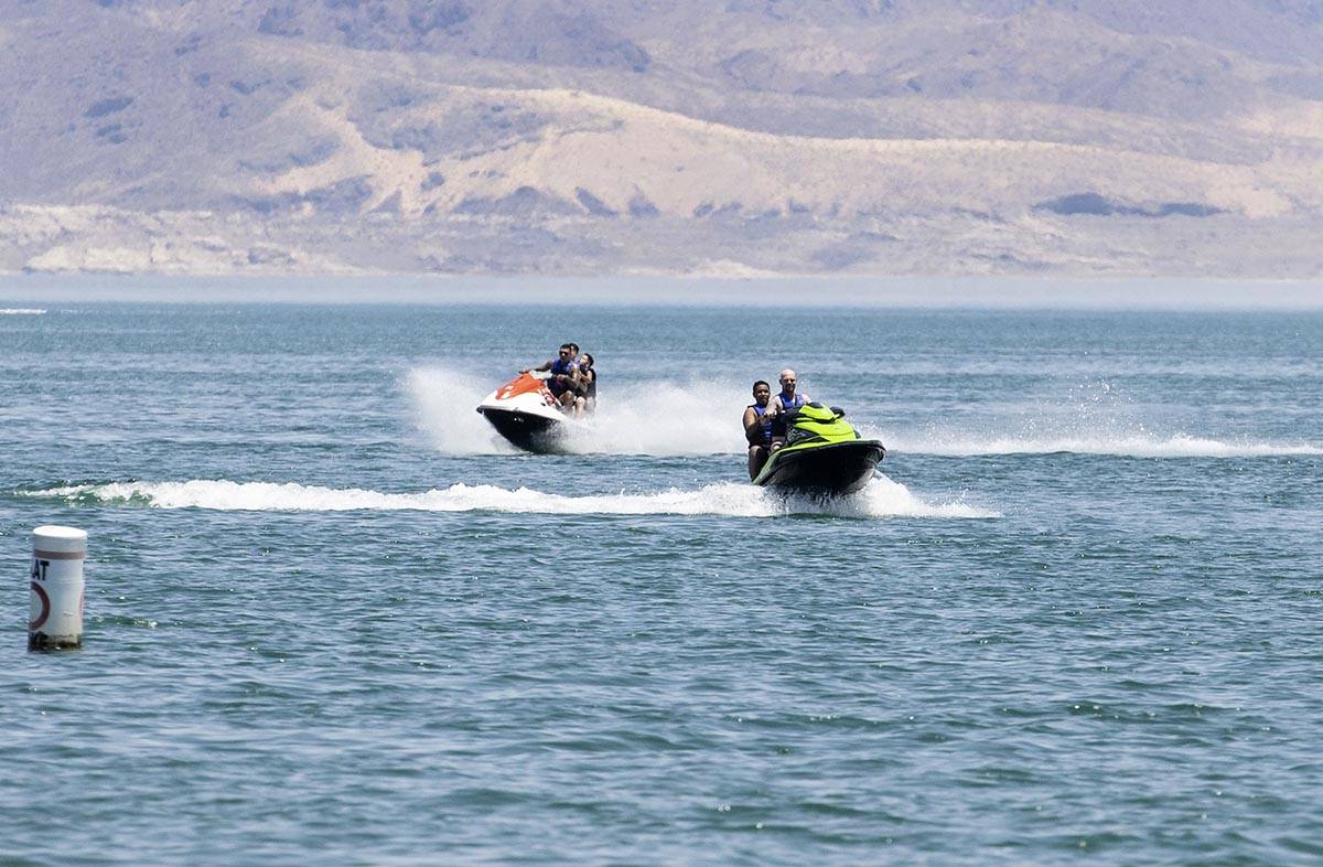People rid their jet ski at Boulder Beach in the Lake Mead National Recreation Area, on Friday, ...