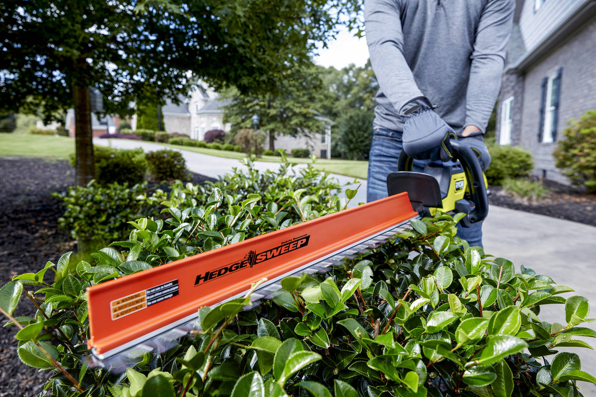 The 40-volt Ryobi 26-inch brushless hedge trimmer is easier to maneuver than corded trimmers. ( ...