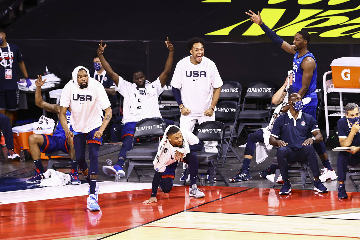 USA players celebrate during the second half of an exhibition basketball game against Argentina ...