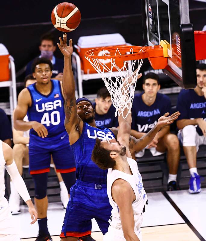 USA’s Bradley Beal (4) shoots around Argentina’s Marcos Delia (12) during the sec ...