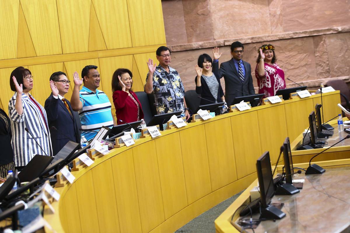 Members of the Asian-American Pacific Islanders Community Commission are sworn in at the Clark ...