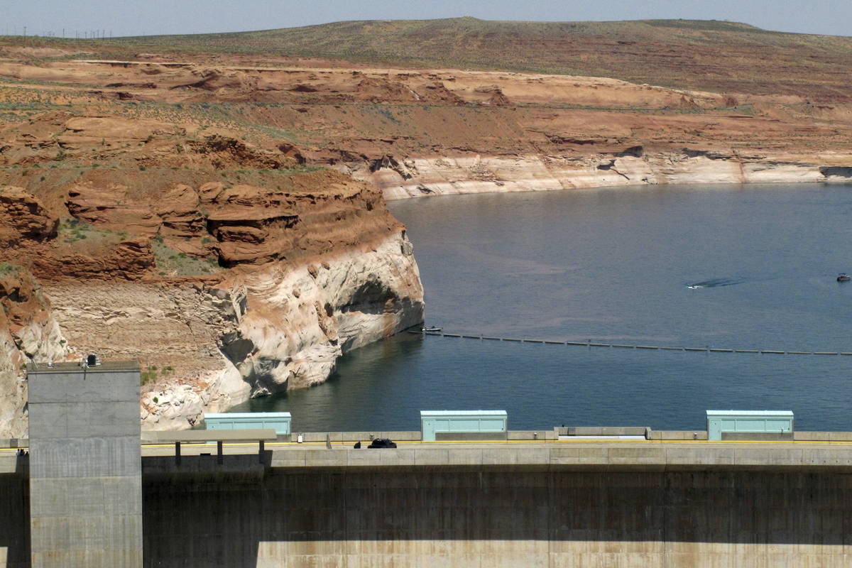 Lake Powell, behind Glen Canyon Dam, is seen near Page, Ariz. (AP Photo/Felicia Fonseca, File)