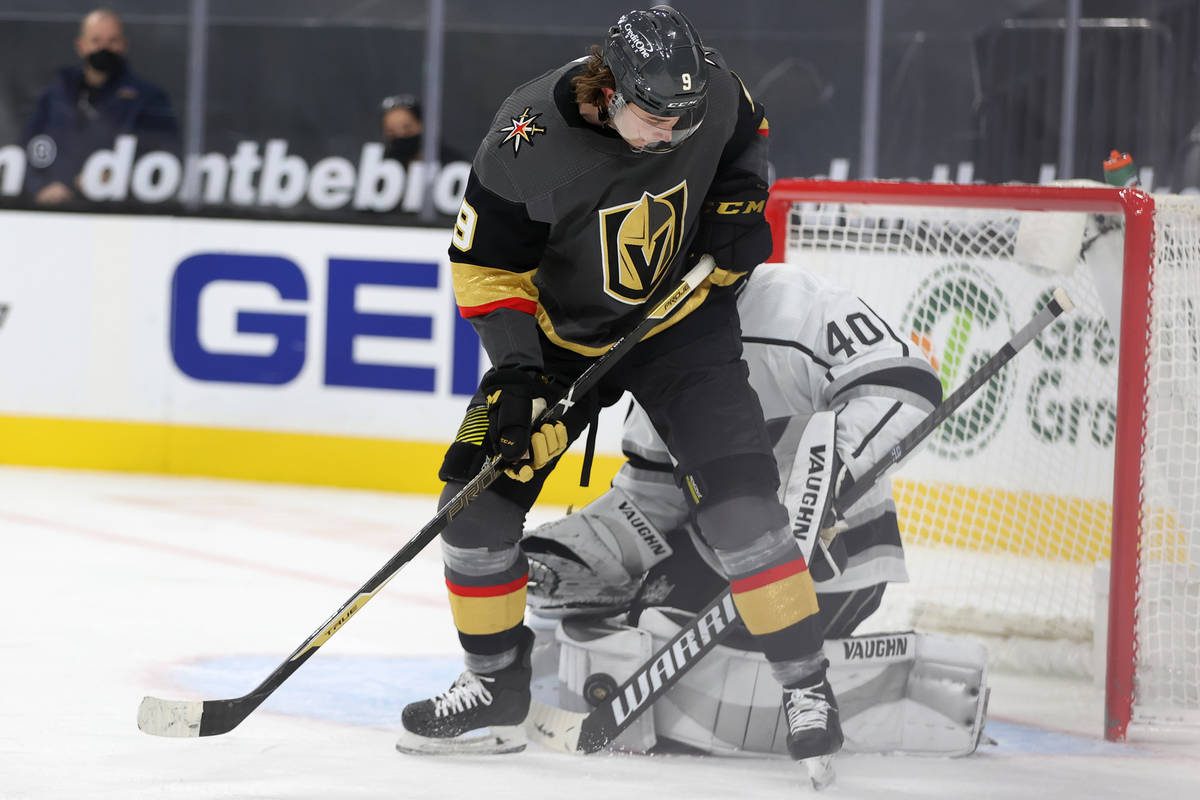 Vegas Golden Knights Cody Glass (9) fights for the puck against Los Angeles Kings goaltender Ca ...