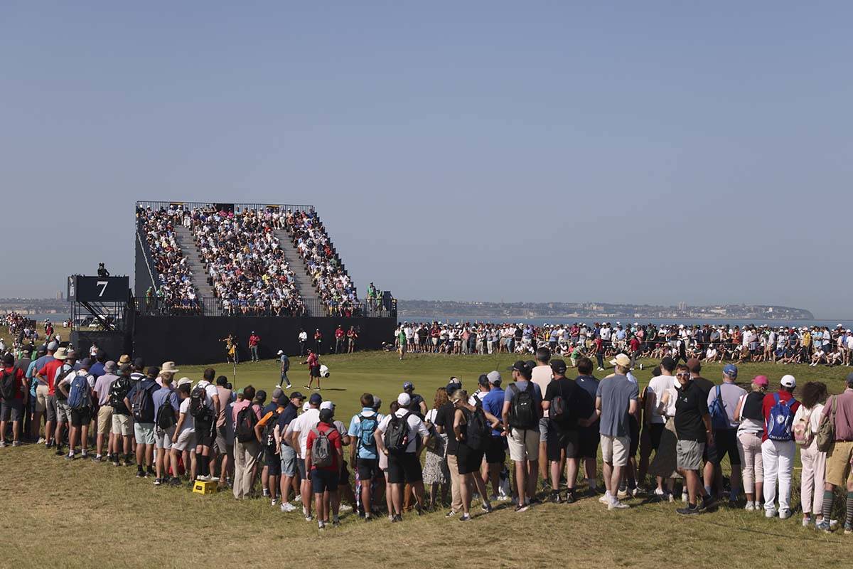 Crowds watch the final spring of United States' Collin Morikawa and South Africa's Louis Oosthu ...