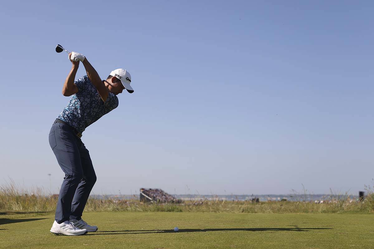 United States' Collin Morikawa hits shot from the 11 hole during the final round of the British ...