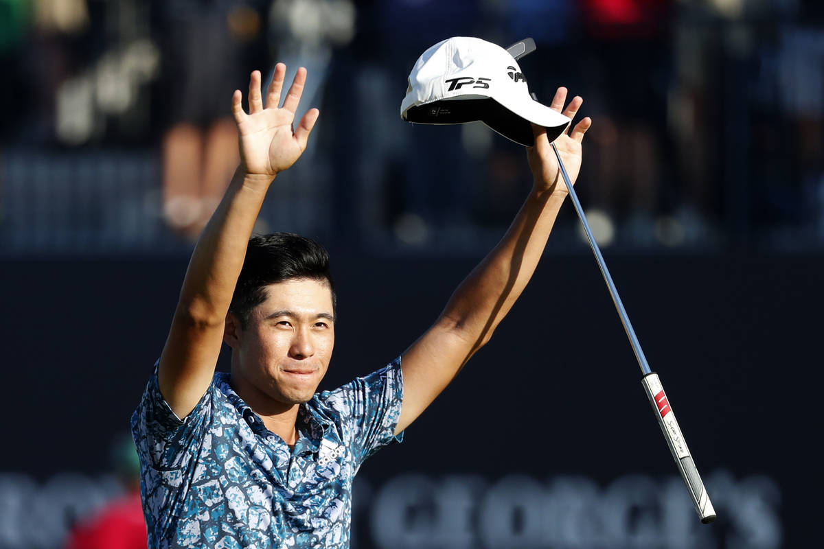 United States' Collin Morikawa celebrates on the 18th green after winning the British Open Golf ...