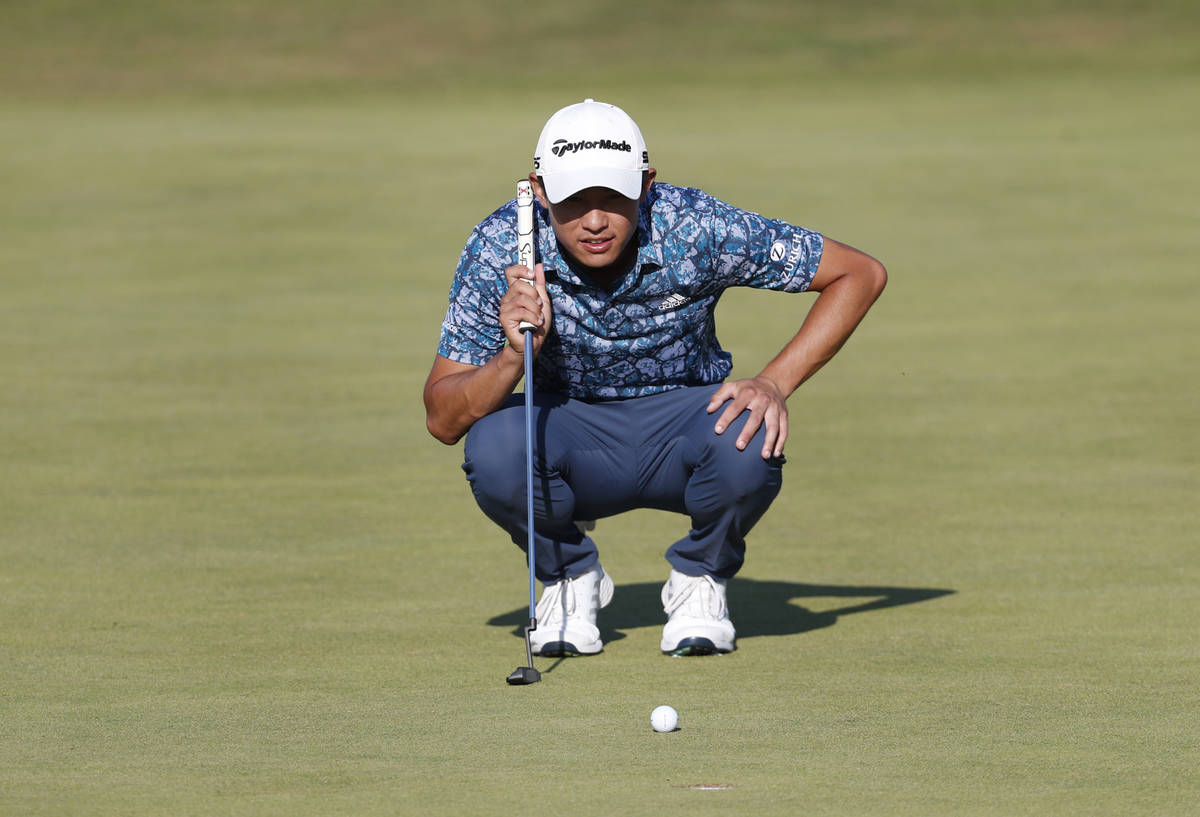 United States' Collin Morikawa lines up his put on the 16th green uring the final round of the ...
