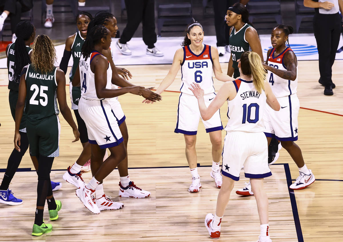 United States guards Sue Bird (6) and Jewell Loyd (4) gather with teammates during a break whil ...