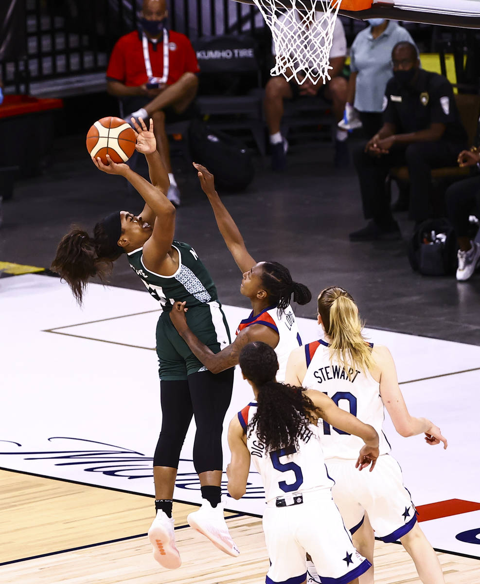 Nigeria guard Erica Ogwumike (31) shoots over United States guard Jewell Loyd during the first ...