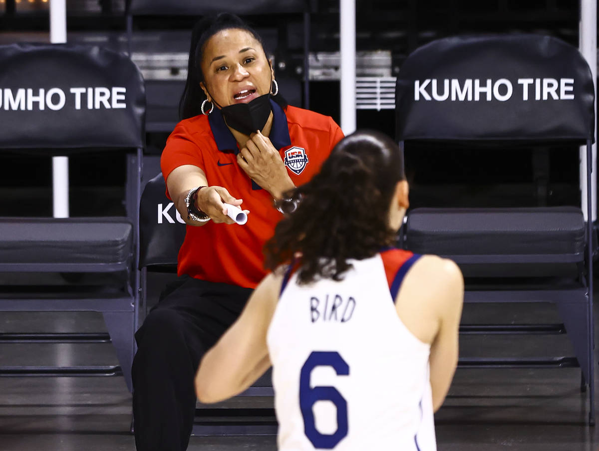 United States head coach Dawn Staley talks with guard Sue Bird (6) before the start of an exhib ...
