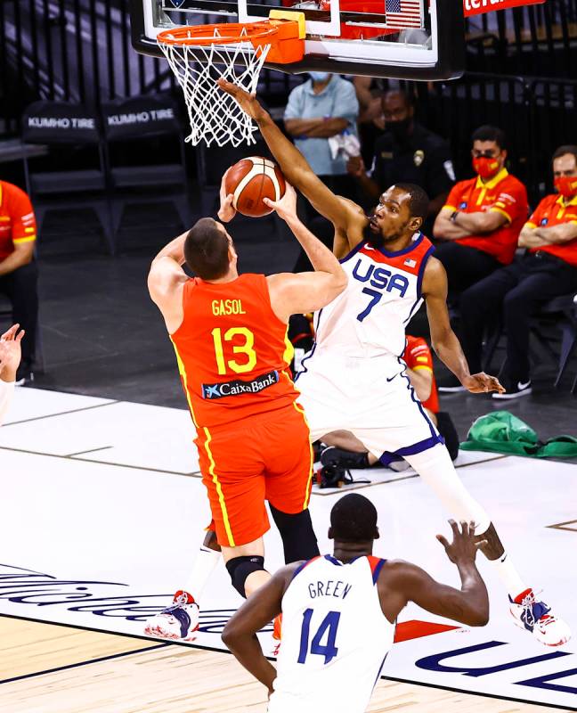 United States forward Kevin Durant (7) blocks Spain center Marc Gasol (13) during the first hal ...