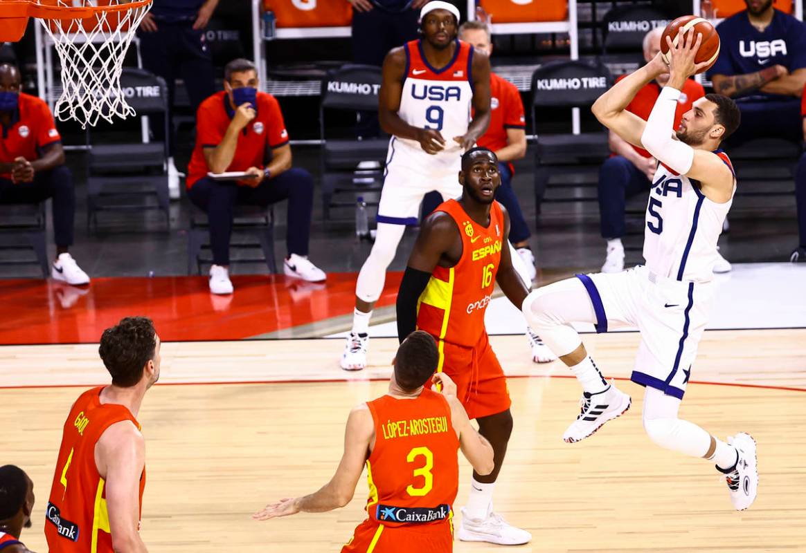 United States guard Zach Lavine (5) shoots in front of Spain forward Usman Garuba (16) during t ...