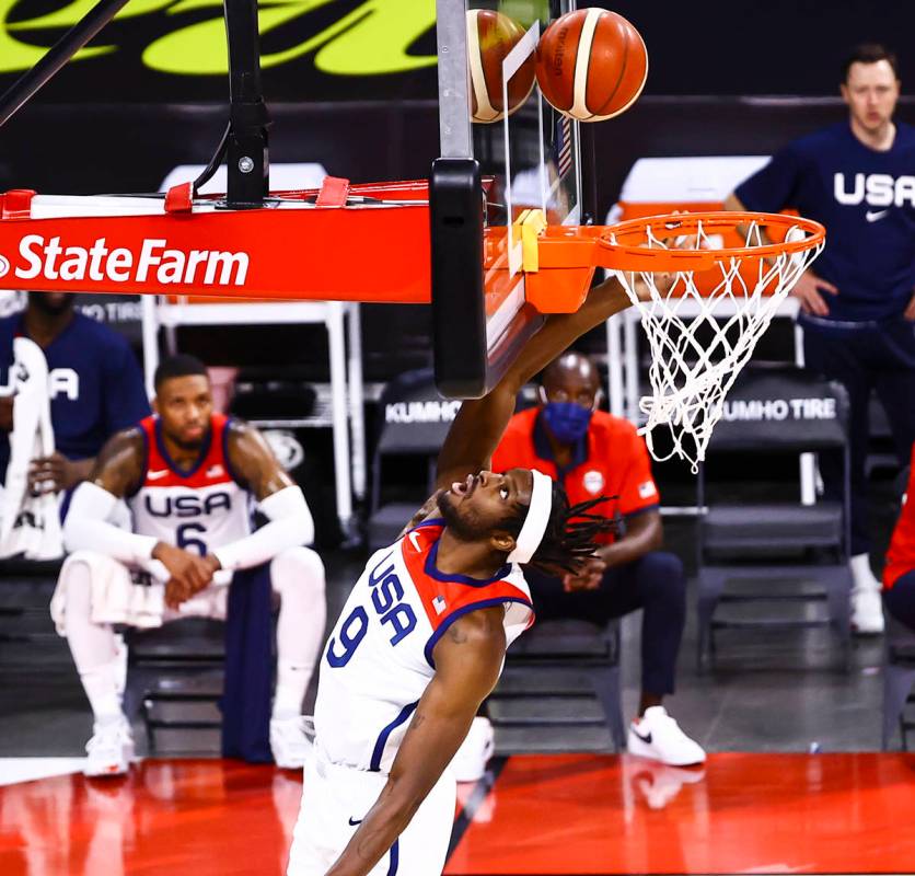 United States forward Jerami Grant (9) lays up the ball against Spain during the first half of ...