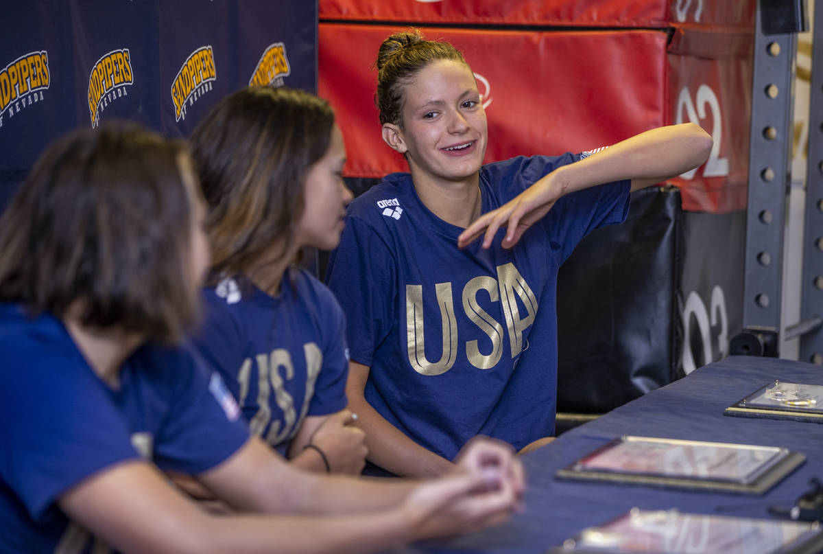 Sandpipers of Nevada Olympic swim team member Katie Grimes, right, answers a media question bes ...