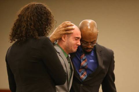 Former Las Vegas police explorer Joshua Honea, center, reacts with his attorneys, Monique McNei ...