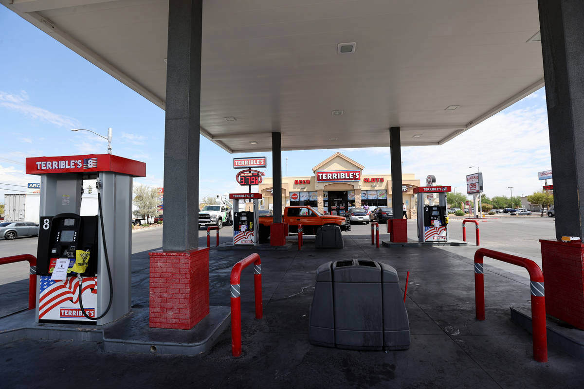 A motorist uses the gas pump area for convenience store parking as the pumps sit empty at the T ...