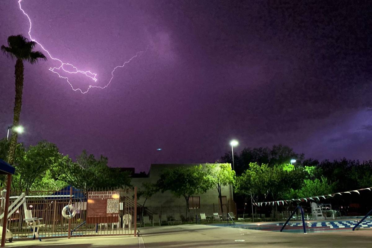 Lightning illuminates the sky above the Trails Pool in Summerlin on Tuesday, July 20, 2021. (Co ...