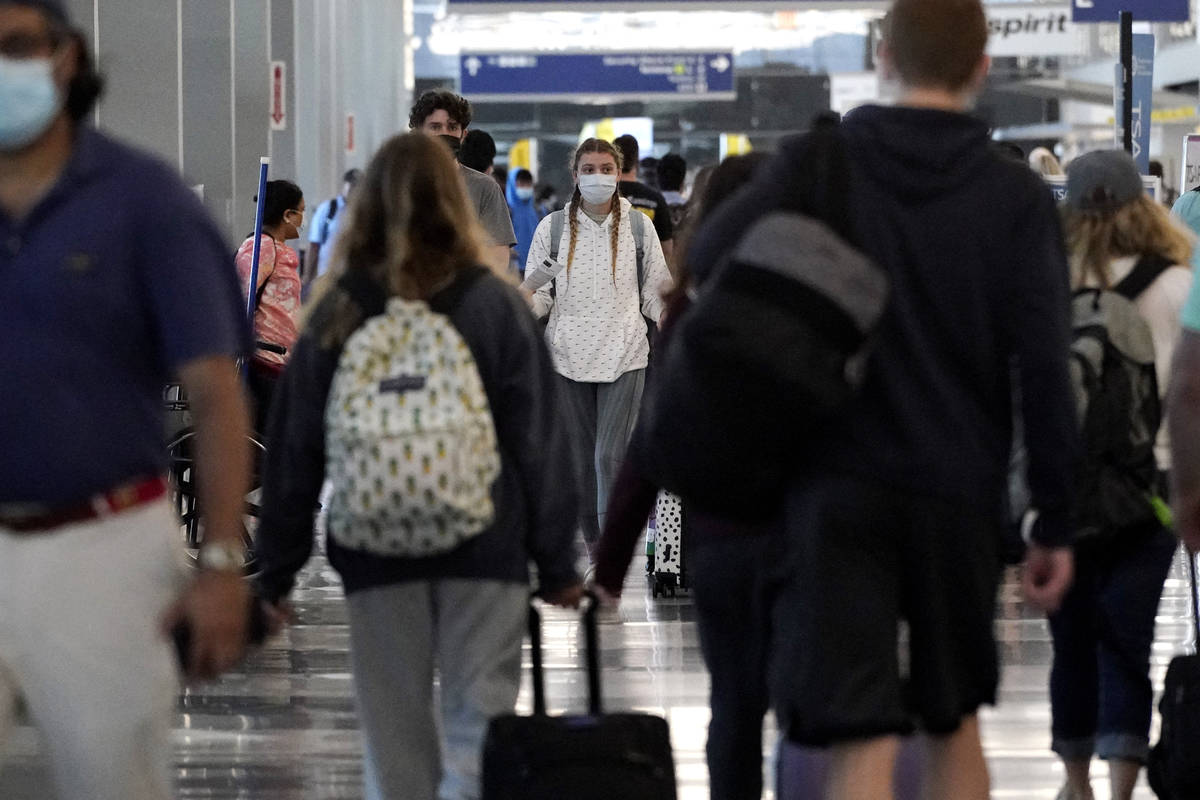 Travelers walk in Terminal 3 at at Chicago's O'Hare International Airport ahead of the Fourth o ...