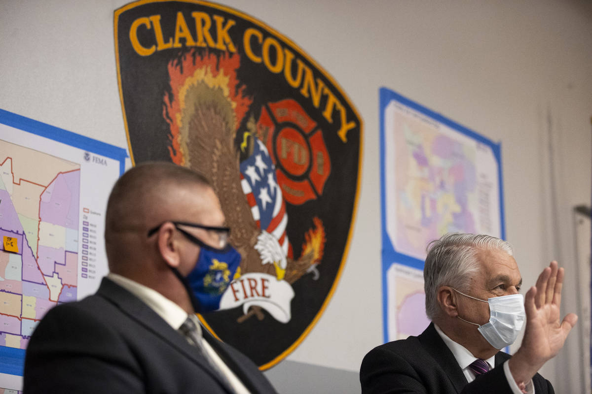 Nevada Governor Steve Sisolak, right, with Nevada Division of Emergency Management Chief David ...